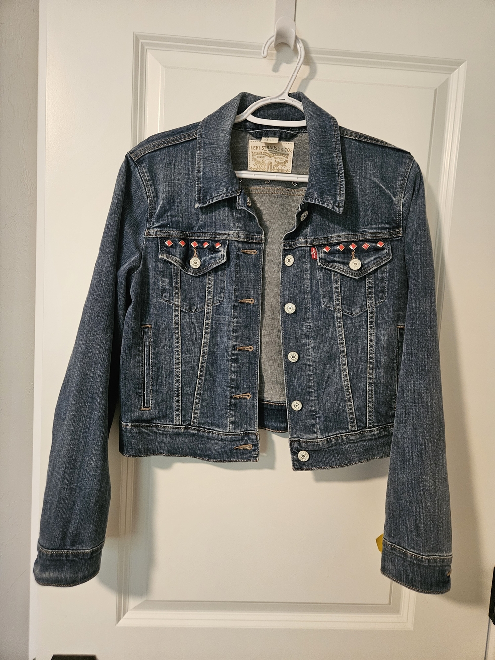 Levi's Dark Blue Denim Trucker Jacket with Red Stud Accents